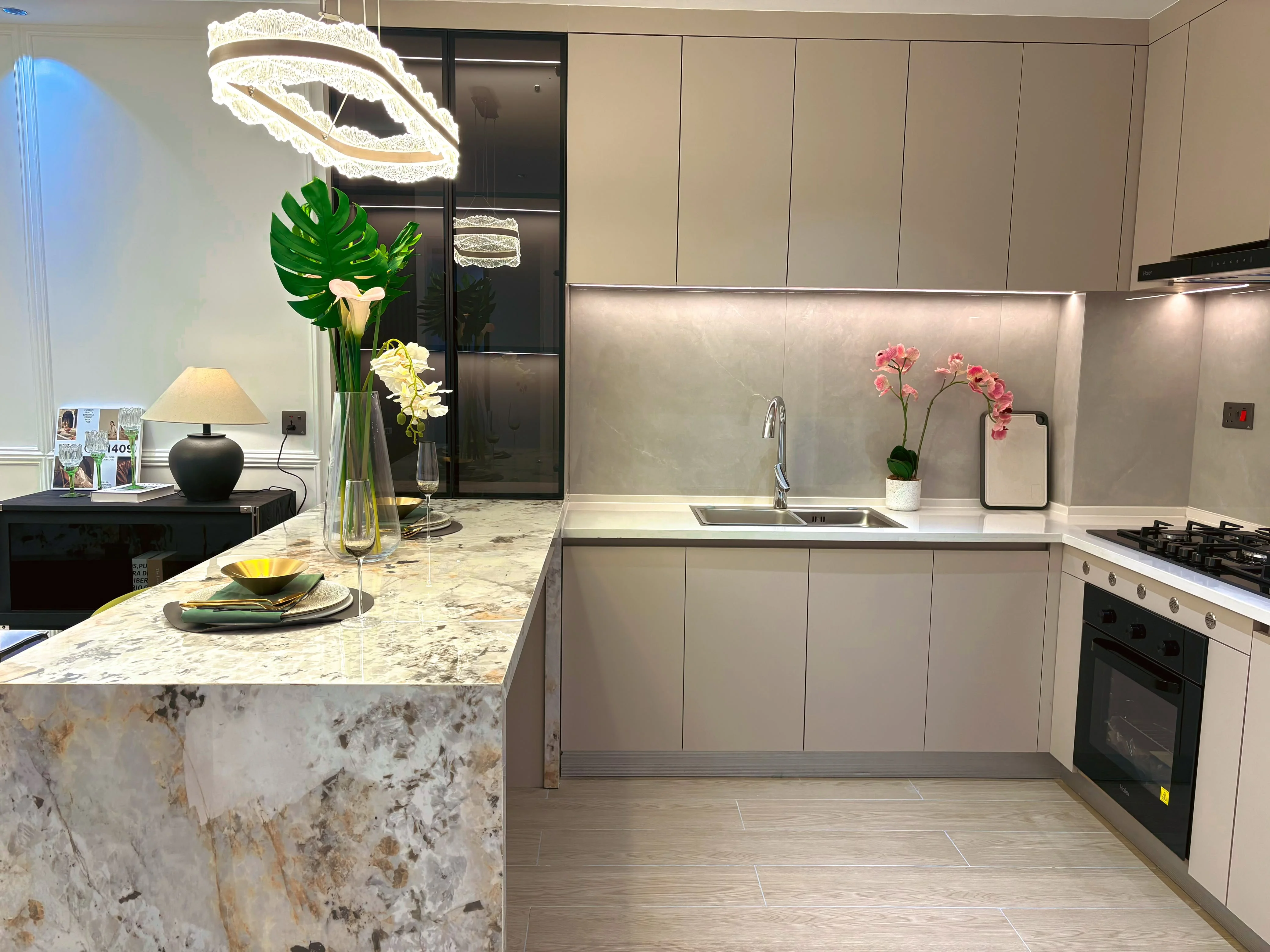 Kitchen at Capital Heights, Westlands, with beige cabinets, a breakfast bar, double sink and built-in oven.