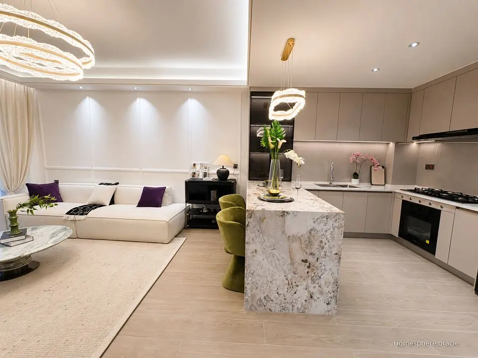 Open-plan living area and kitchen at Capital Heights, Westlands, with a white sofa, breakfast bar and pendant lights.