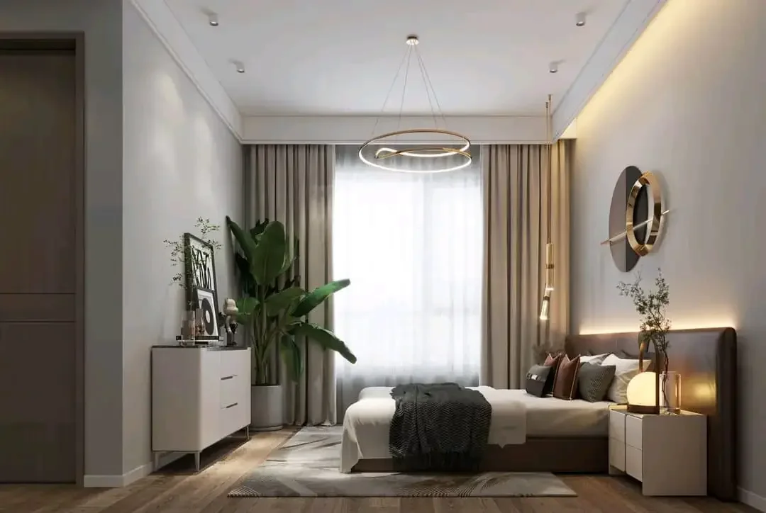 Bedroom at Citrine Heights, Westlands, with a double bed, ring pendant light and floor-length curtains.