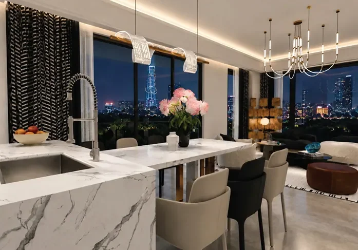Open-plan kitchen and living area at Himalaya Halo, Westlands, with breakfast bar seating and pendant lights.