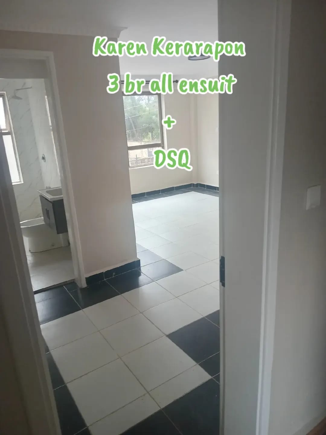 Unfurnished room with white and dark floor tiles and an adjacent bathroom in Karen, Kerarapon.