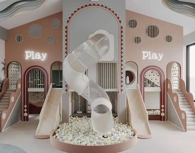 Indoor children’s play area at Lilydale Riverside with slides and a central ball pit.