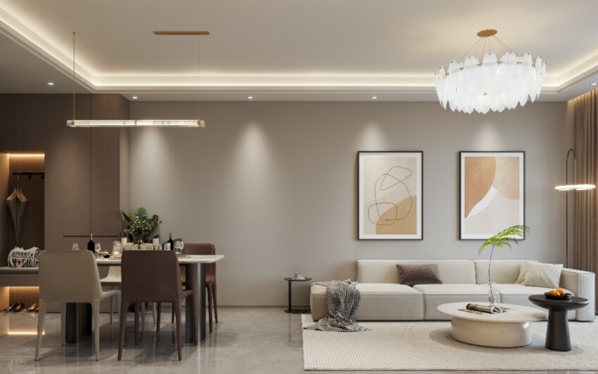 Living and dining area in Loresho, Nairobi, with a cream sofa, chandelier and framed artwork.