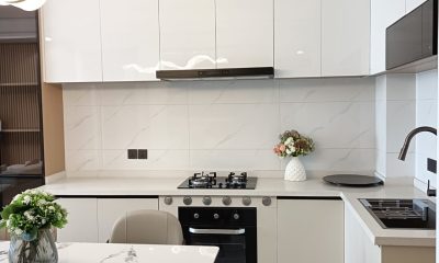 Kitchen at San Remo Heights, Westlands, with white cabinetry, a gas hob, built-in oven and sink.