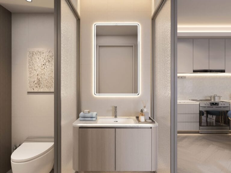 Vanity and illuminated mirror beside a toilet enclosure, with the kitchen visible at Santorini Residences, Westlands.