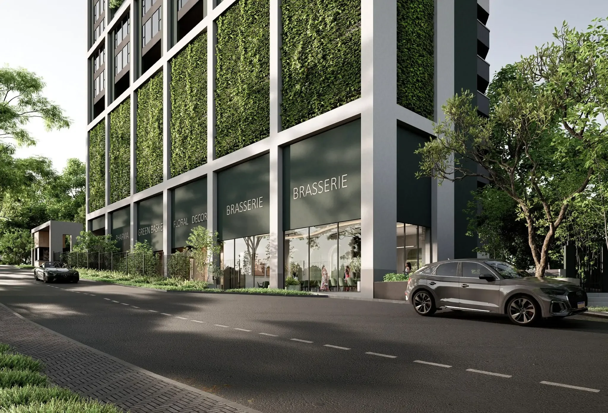 Exterior rendering of Terreno Apartments on Riverside Drive, showing glass storefronts and greenery-covered facade panels.